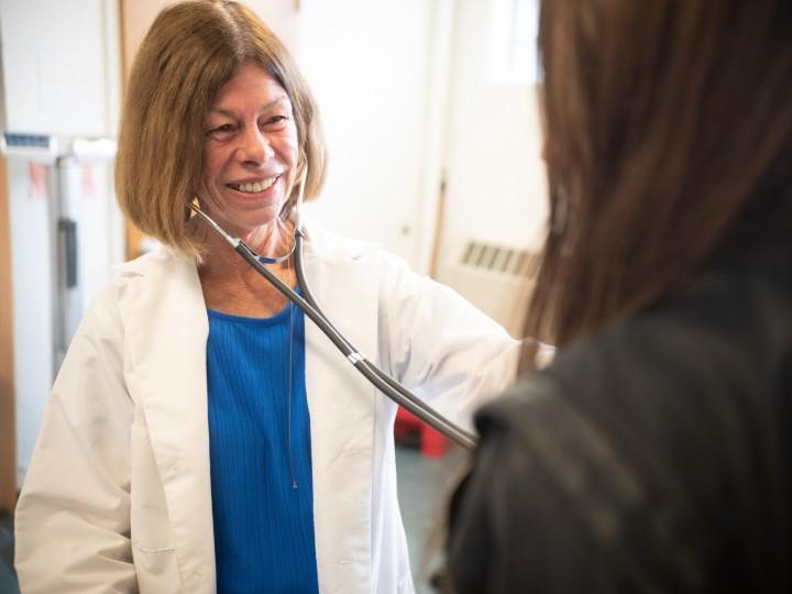 A student gets blood pressure taken by a nurse at the ACPHS wellness center